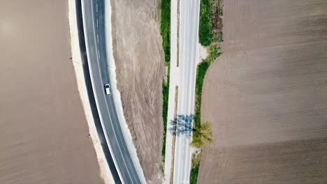 AERIAL---Highway-and-railroad-construction-in-Baden,-Austria,-wide-shot-top-down