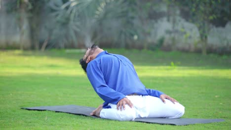 advanced yoga pose done by an indian man