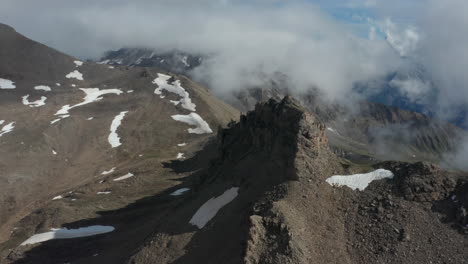 aerial of rocky mountain wall on summit