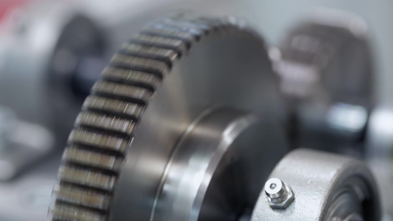 Close-up of Metal Gear Rotating in Industrial Machinery