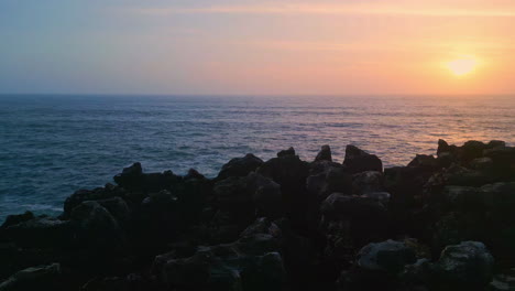 golden sun going down ocean horizon in marine evening. aerial view orange sunset