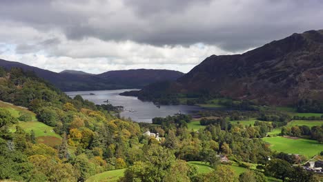 panning view over ullswater lake in the english lake district on a bright autumn day