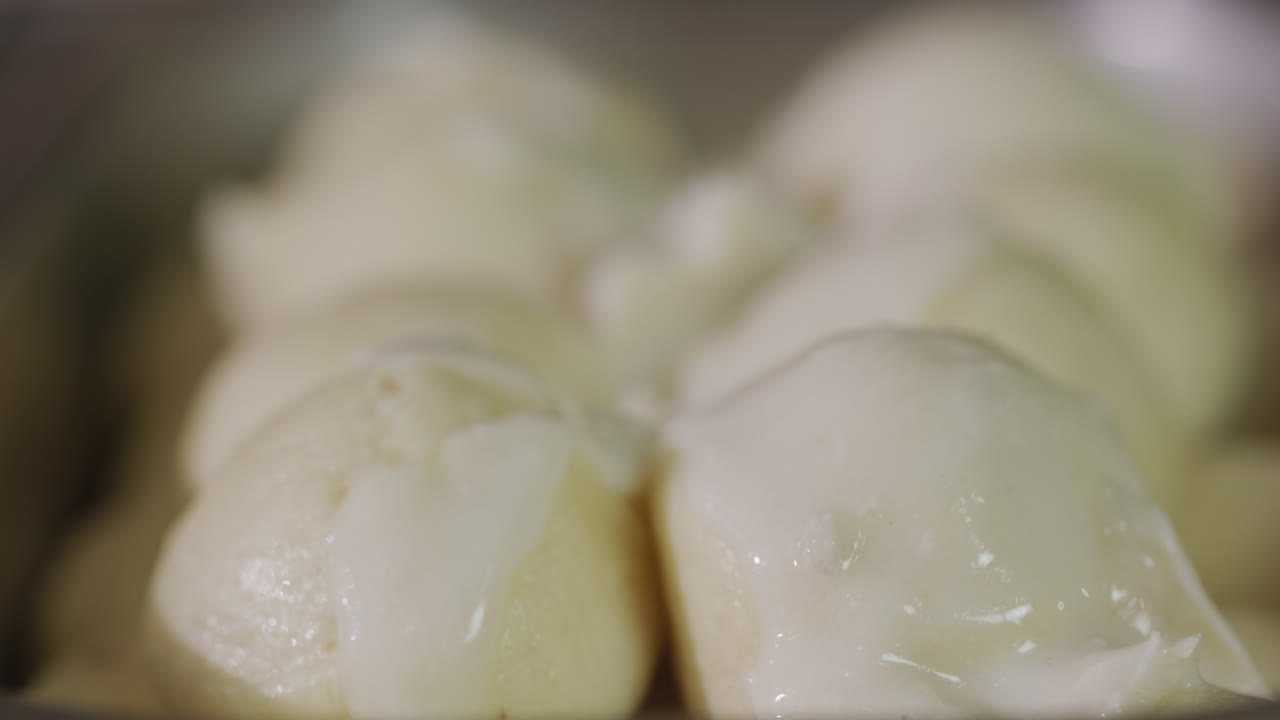 Dumplings are poured with delicious creamy sauce