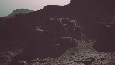 a dramatic mountain range with rocky cliffs