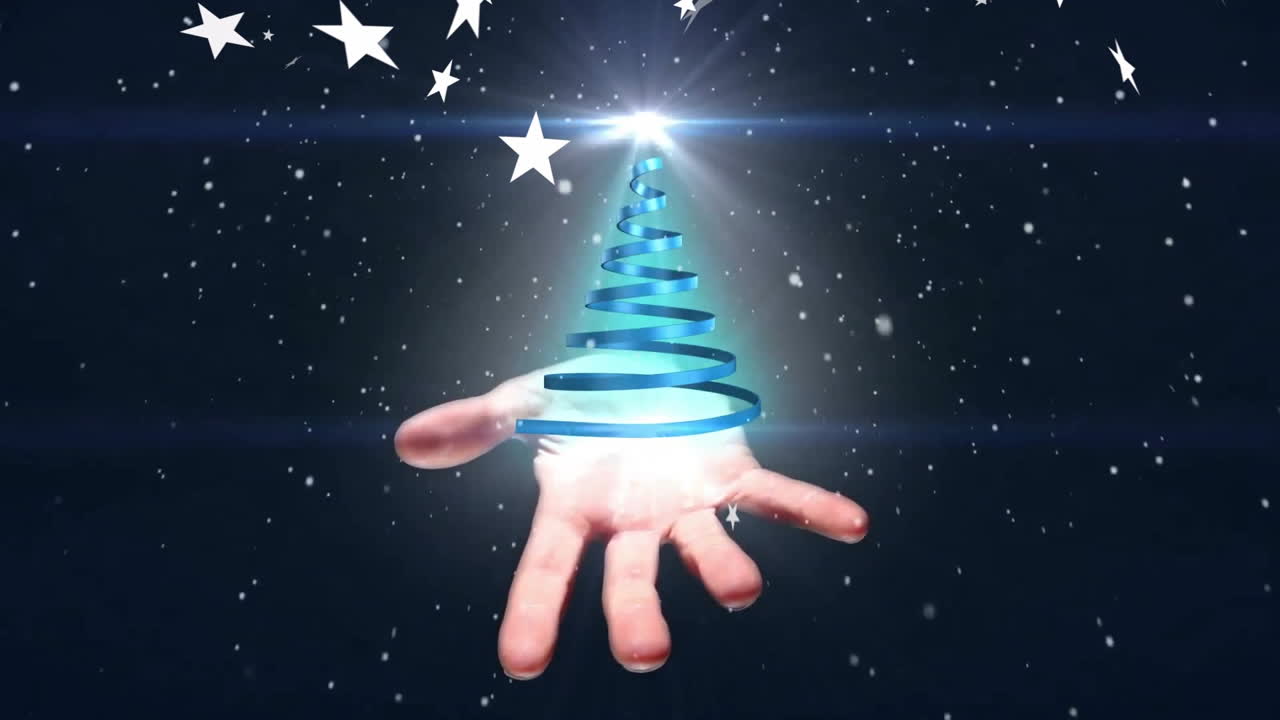Animation of snow and stars over hand holding blue ribbon forming christmas tree on black background
