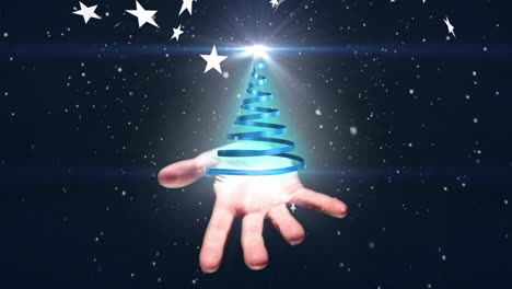Animation of snow and stars over hand holding blue ribbon forming christmas tree on black background