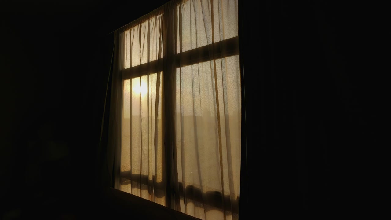 Sunrise light gradually brightens sheer curtains in a quiet Dubai hotel room