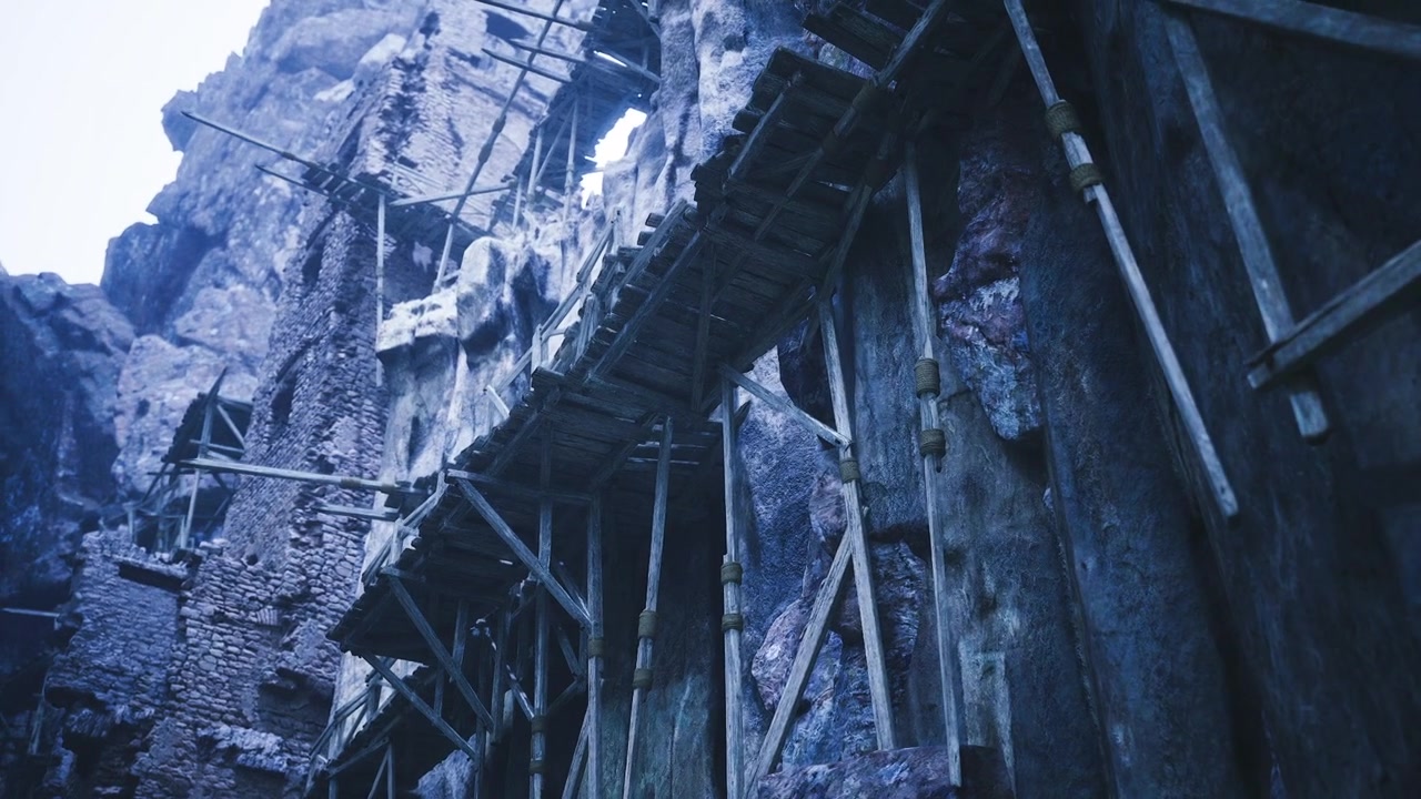 Challenging icy ascent snowcovered bridge over treacherous cliffs