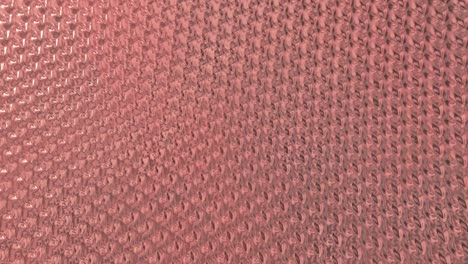 rose gold foil background. gold texture 3d rendering loop 4k