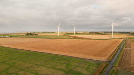 windturbines during sunset in the south west of the netherlands