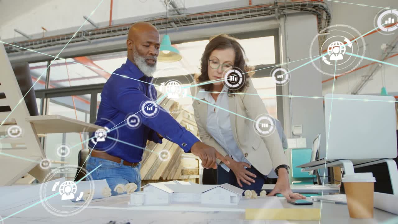 Architect and project manager examining architecture model in office, showing floating data overlay