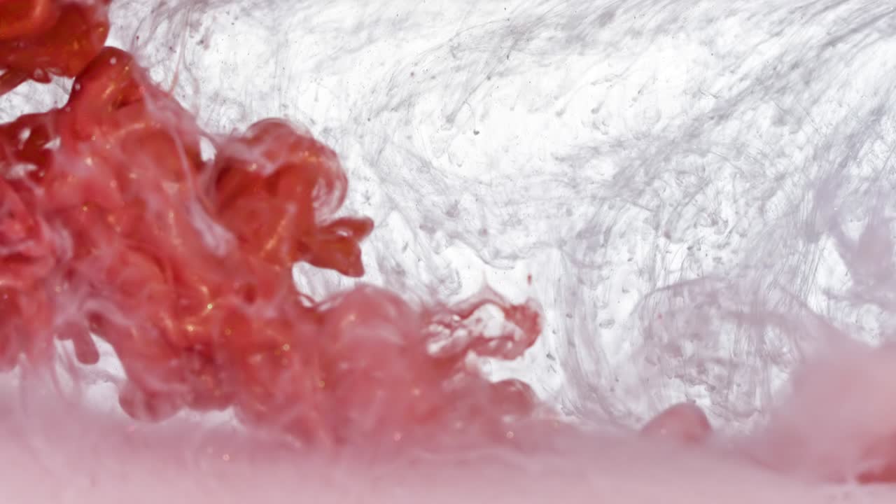 White and Red Gold Ink in Water