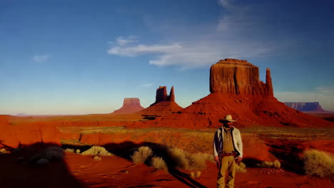 monument valley at sunset with a person