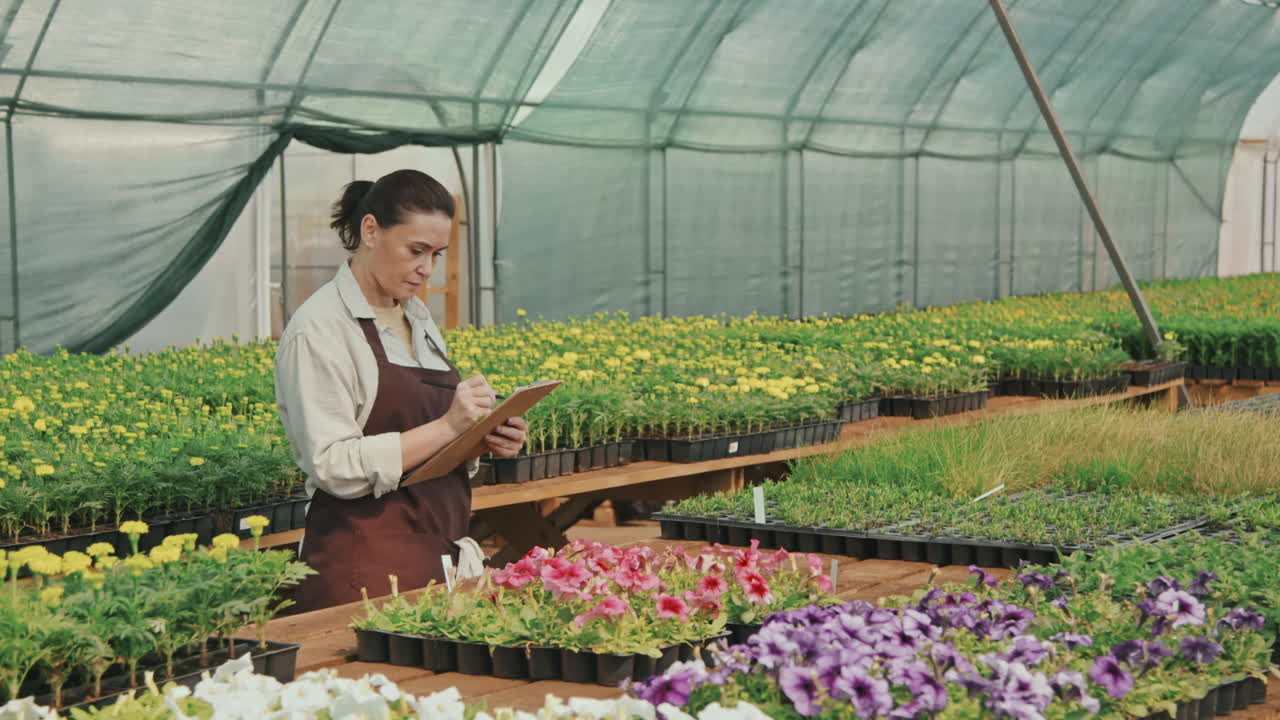 Woman Working in Greenhouse