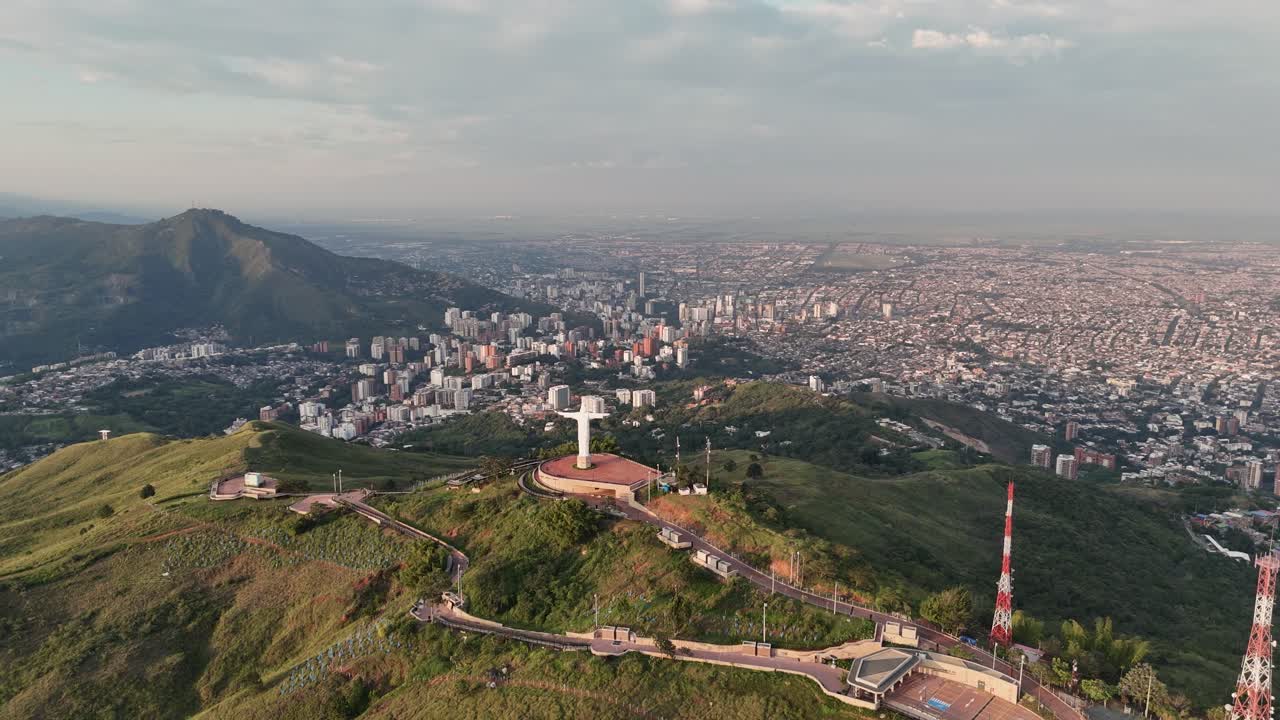 Panoramic aerial view of the Cristo Rey statue overlooking the city of Calí, Colombia