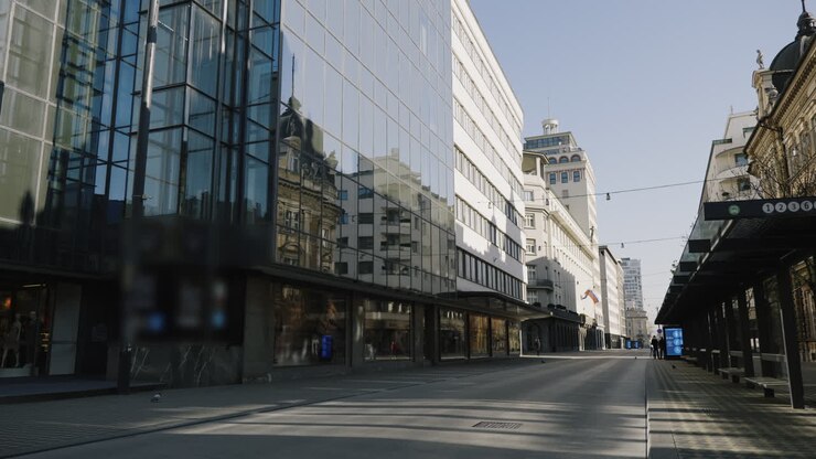 Empty City Street with Modern Buildings and Bus Stop