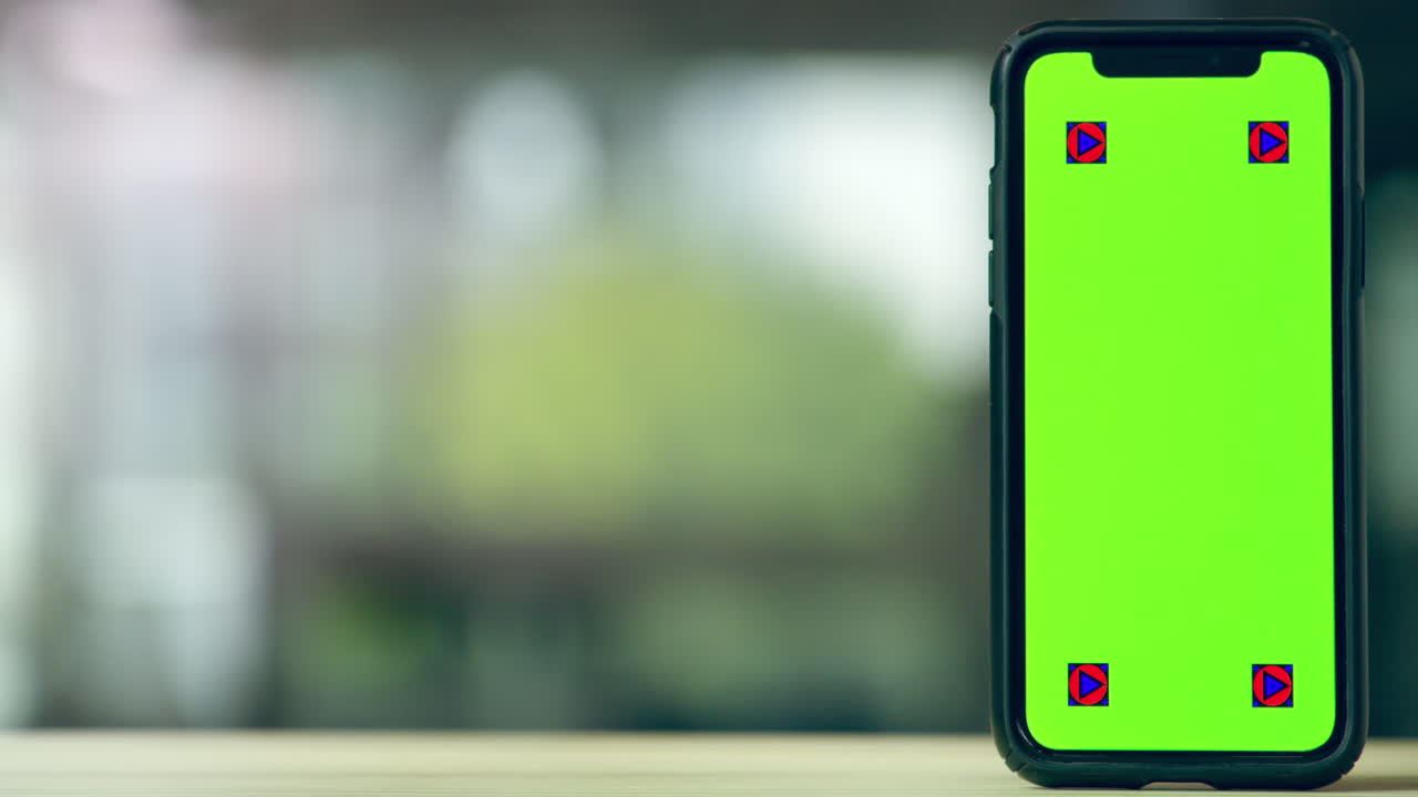 초록색 화면을 가진 스마트 폰이