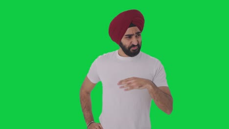 Sikh-Indian-man-upset-by-bad-smell-Green-screen