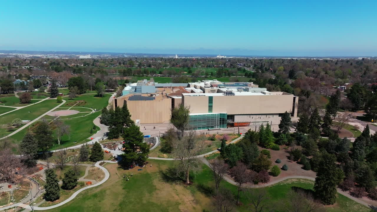 The Denver Museum of Nature and Science building city living Ferril Duck Lake City Park Pavilion Golf Course Downtown Denver Cityscape Colorado aerial drone spring summer upwards motion