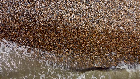 sea waves hitting pebble beach at deal in kent