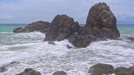 Ocean-Waves-in-Slow-Motion-Over-Coastal-Rocks-at-Banbanon-Beach,-Surigao-Del-Norte,-Philippines
