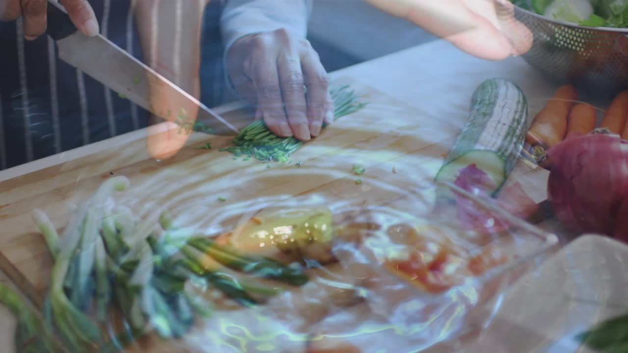 Senior woman's hands aligning blade and slicing spring onions with ripple overlay for kitchen prep