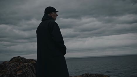senior man contemplating ocean view