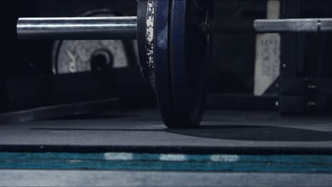 deadlift bar hitting the ground in slow motion