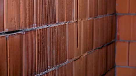 red brick wall under construction