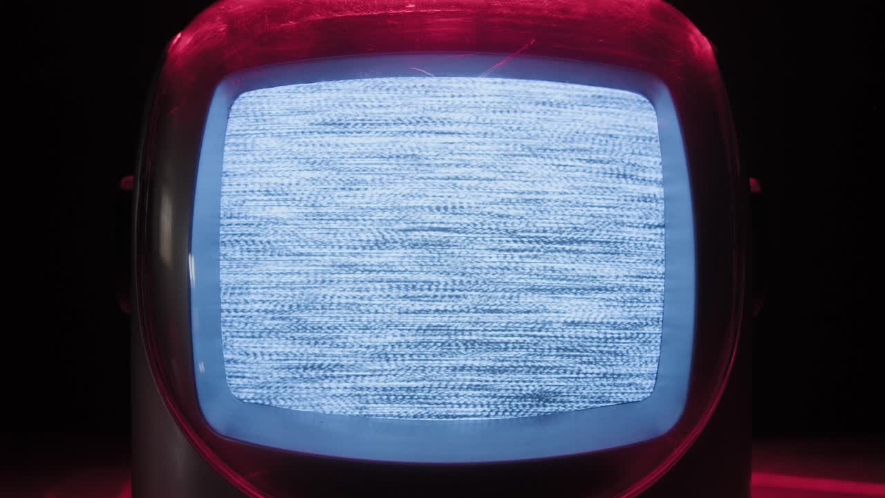 Retro TV, vintage television In a nostalgic setup, a retro TV displays grain on screen, scary halloween night device good for chroma key and green screen. High quality 4k footage