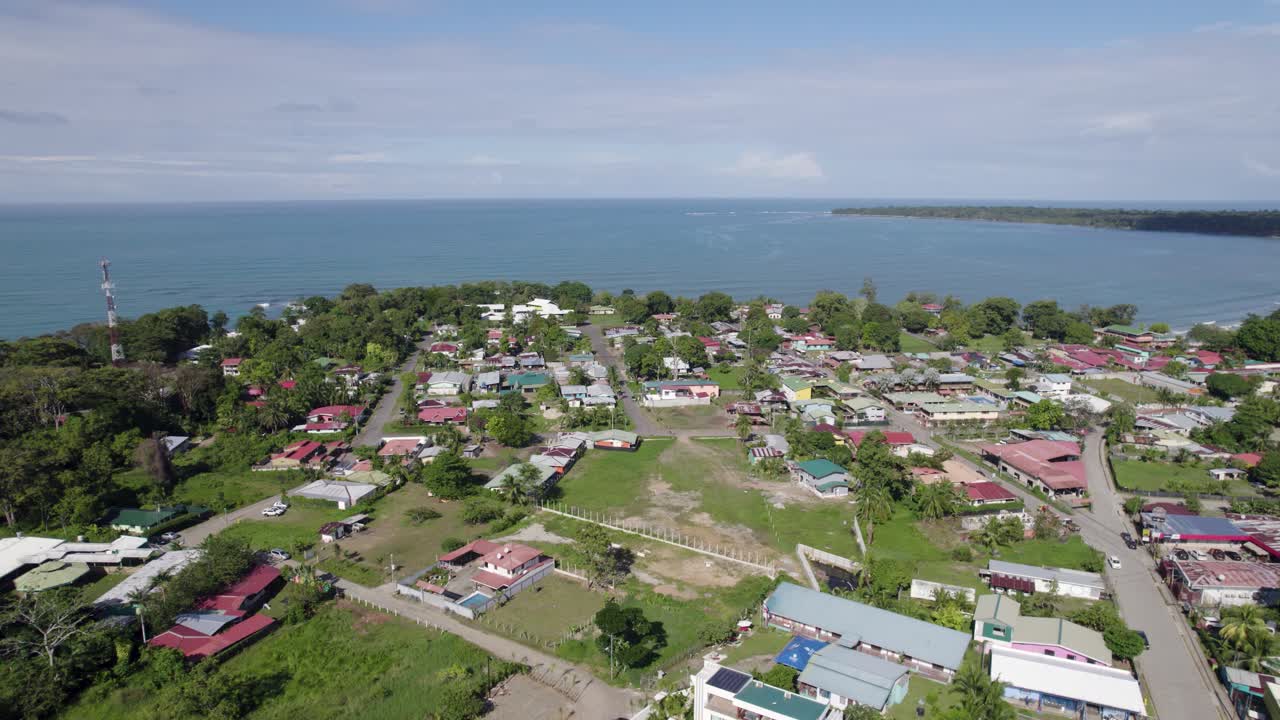 Aerial - coastal town Cahuita, Costa Rica, near the Caribbean Sea shoreline
