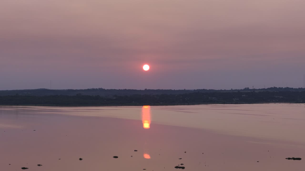 A sunset on Paran&aacute; River, on Posadas, Misiones, Argentina