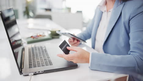 woman shopping online with laptop and credit card