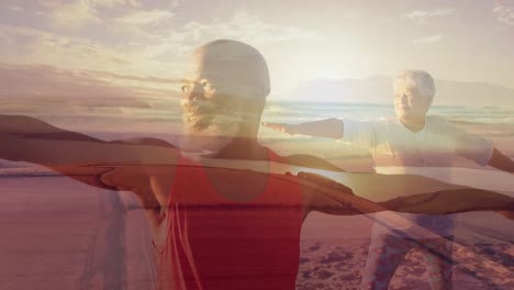 animation of glowing spots over happy african american senior couple exercising on beach