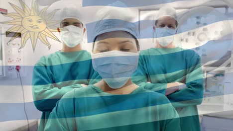 Animation-of-flag-of-uruguay-waving-over-surgeons-in-operating-theatre