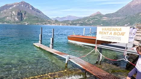 family exploring boat dock in varenna, italy