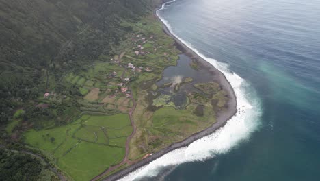 High-angle-aerial-view-of-Fajã-dos-Cubres---scenic-São-Jorge-coastline,-Azores