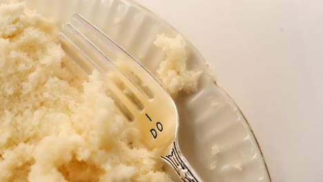 Wedding-fork-engraved-with-"I-Do"-with-white-wedding-cake