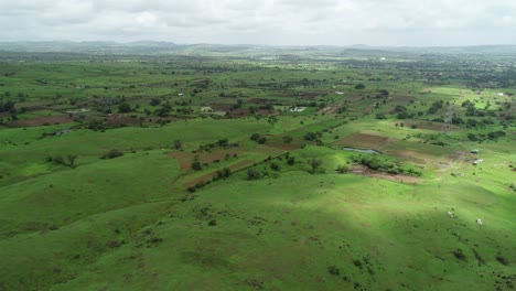 Aerial-footage-of-farmland-in-Maharashtra,-India-during-annual-rainy-season-due-to-monsoon