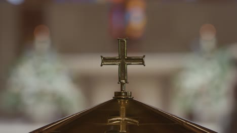 closeup of cross on podium in catholic church