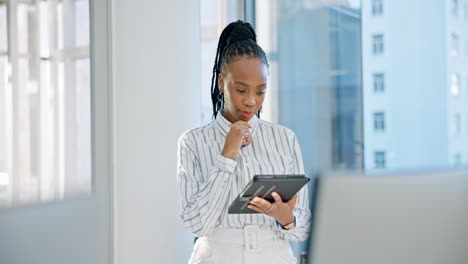 Internet,-tablet-and-a-business-woman-in-office