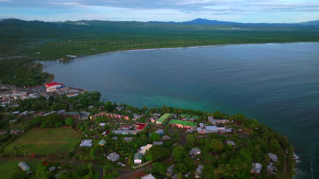 Morning ocean waves Wewak Hill cape peninsula summer dry season Wewak costal town aerial drone Papua New Guinea PNG panoramic ocean view Dogreto Bay blue sky Boram Road Inn Boutique Hotel forward pan