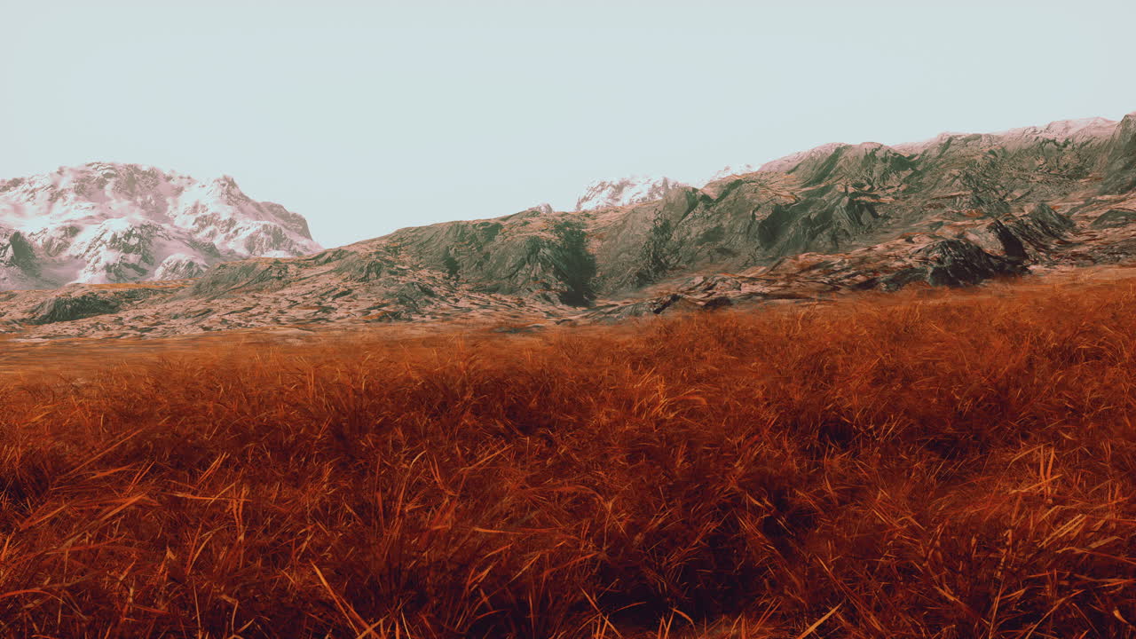 impresionante cordillera con un campo de hierba en primer plano