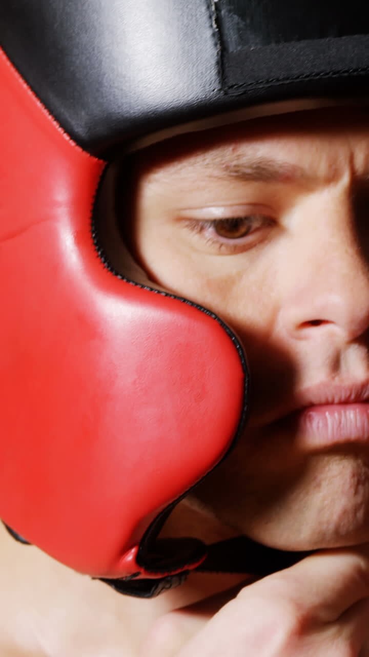 Male boxer wearing headgear