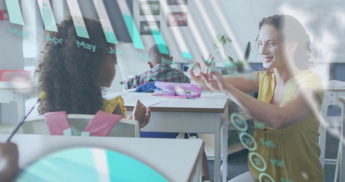 Teacher kneeling holding up fingers teaching counting, girl mirroring, charts overlaying classroom