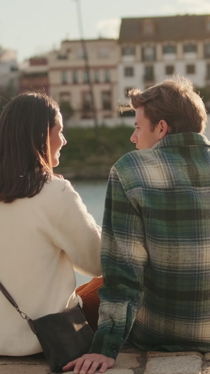 Couple Enjoys Seville Sunset by the Canal