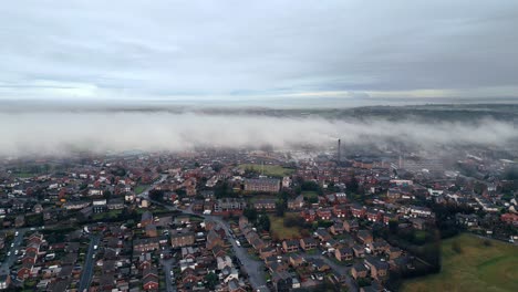 Decending-Morning-misty-winter-urban-aerial-scene