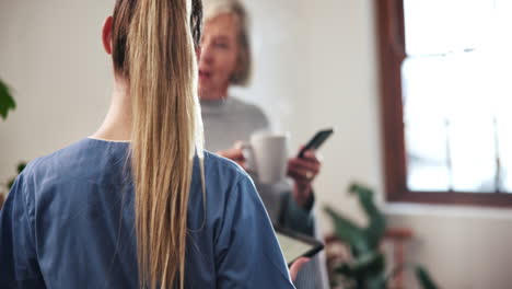 nurse, tablet and elderly woman talking