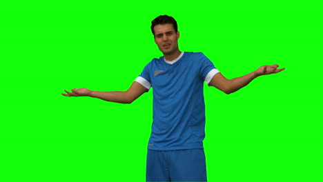 Furious-football-player-gesturing-on-green-screen