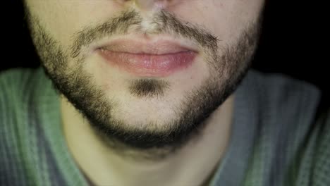 close-up of a man's face and beard